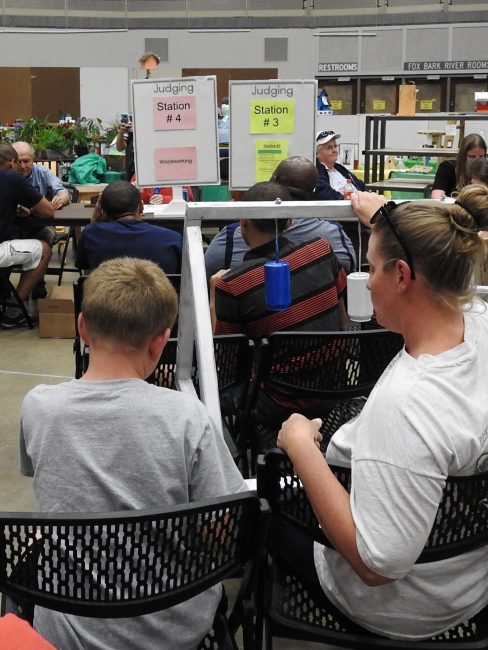 Youth waiting in line to talk to a judge for project judging at the Waukesha County Fair. 