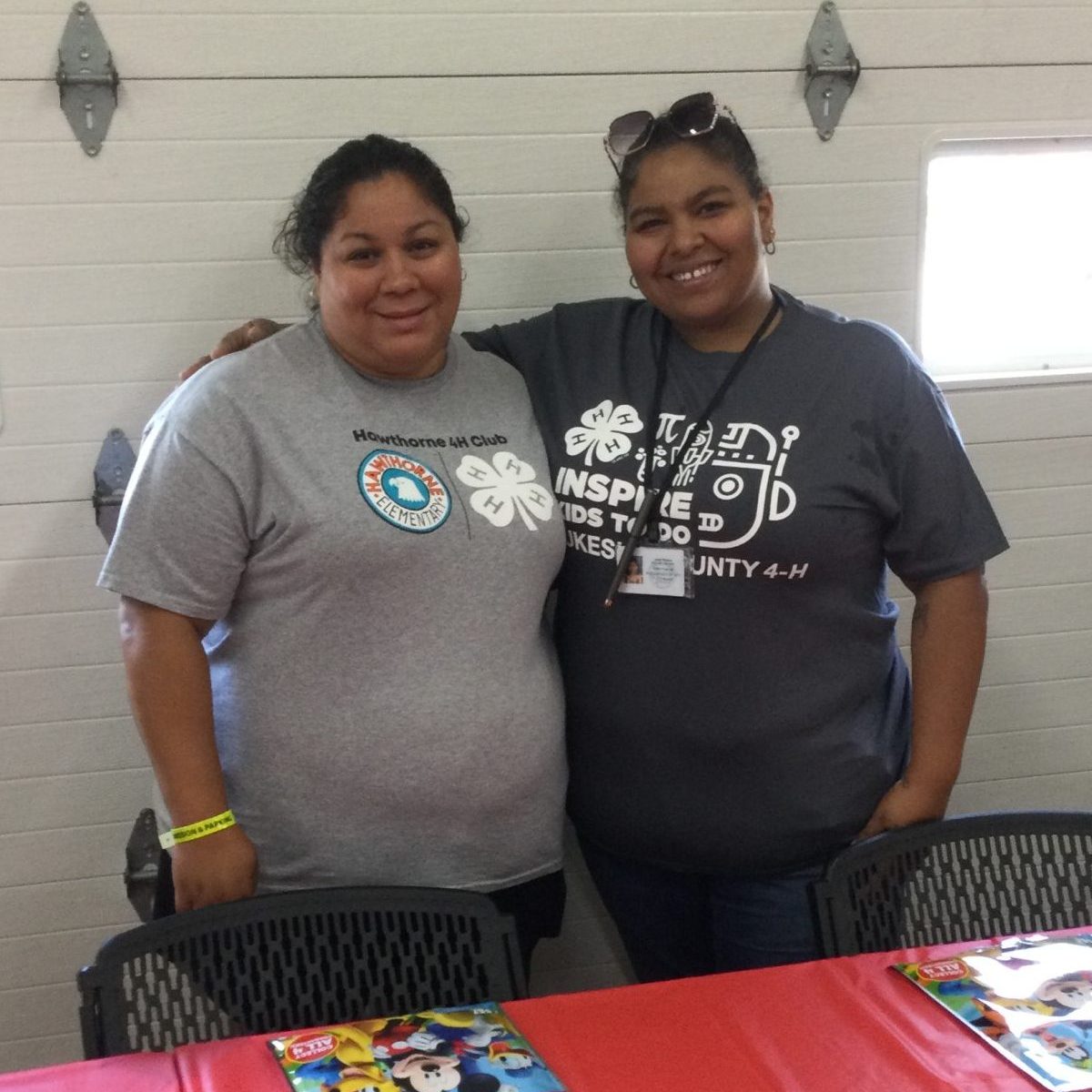 Two female 4-H volunteers smiling